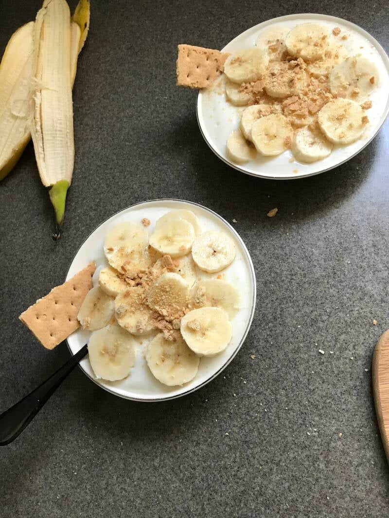 A bowl of Cannabis Honey Vanilla Yogurt with Bananas, perfect for cannabis edibles and Stoner Strategies enthusiasts!