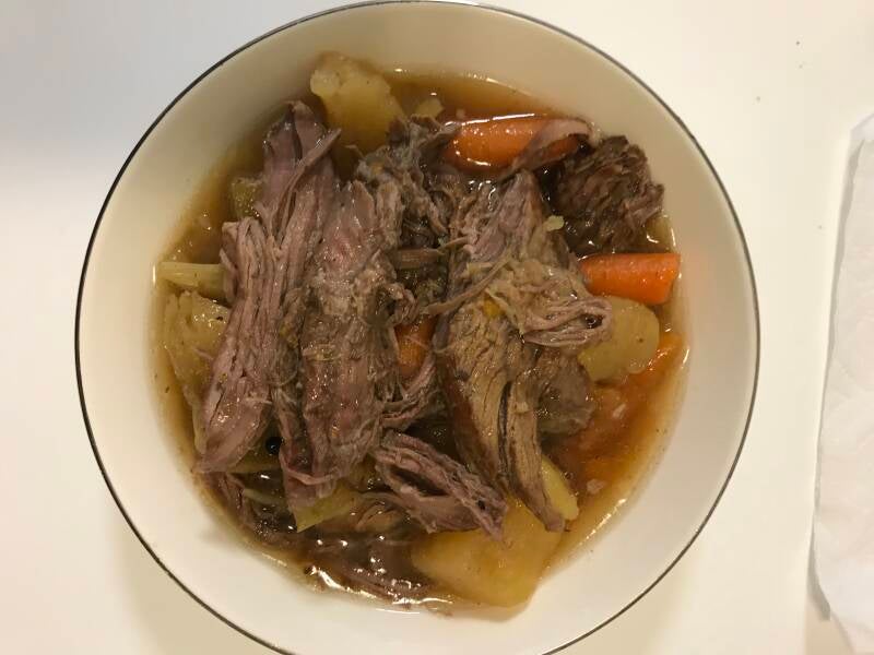 A steaming bowl of Crockpot Cannabis Honey Whiskey Beef Stew, a perfect meal for cannabis edibles and Stoner Strategies enthusiasts