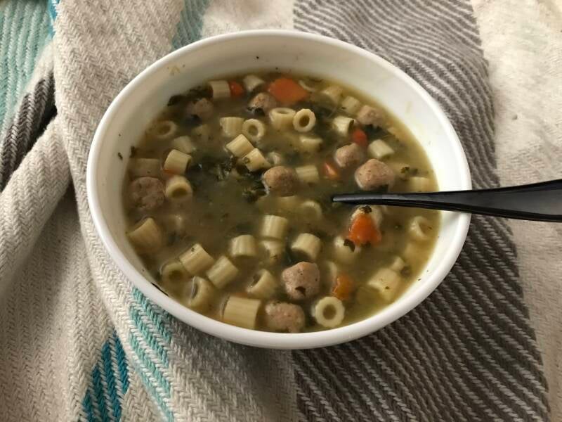A steaming bowl of Cannabis Italian Wedding Soup, perfect for cannabis edibles and Stoner Strategies enthusiasts.