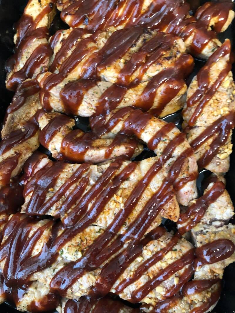 A platter of golden-brown Cannabis BBQ Spare Ribs, perfect for cannabis edibles and stoner strategies enthusiasts.