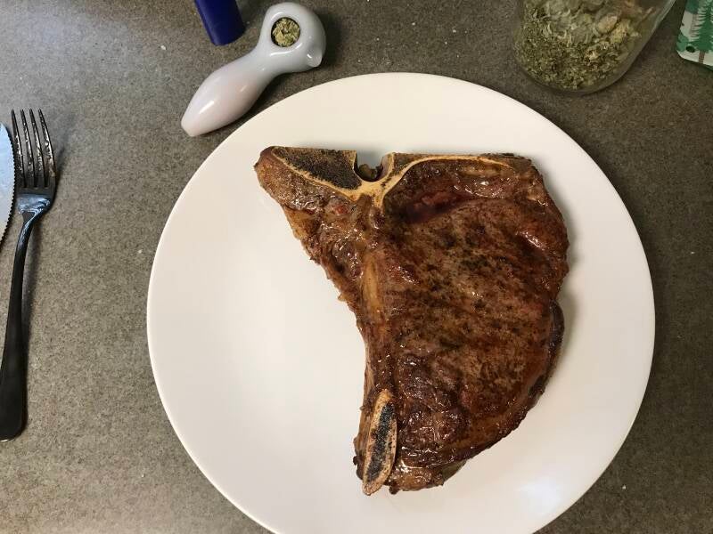 A perfectly seared Cannabis T-Bone Steak, the ultimate gourmet meal for cannabis edibles and stoner strategies enthusiasts