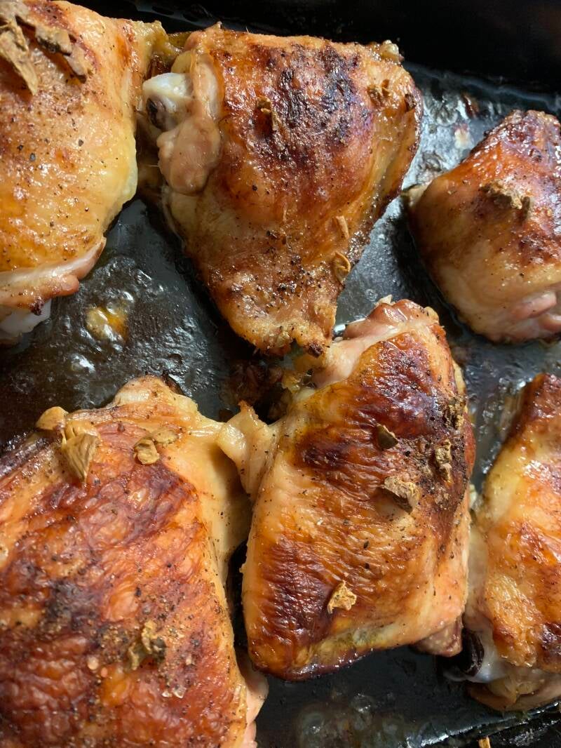 A tray of glazed Honey Whiskey Chicken Thighs, perfect for cannabis edibles and stoner strategies enthusiasts.