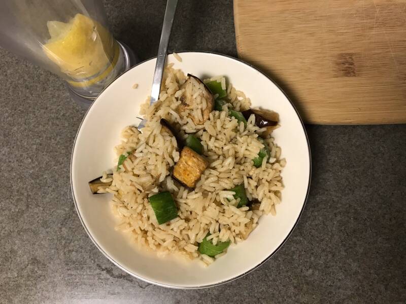 A bowl of Cannabis Eggplant, Rice, and Okra, perfect for cannabis edibles and Stoner Strategies enthusiasts
