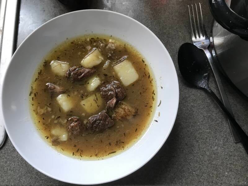 A steaming bowl of savory Cannabis Steak and Potato Soup, ideal for cannabis edibles and stoner strategies enthusiasts