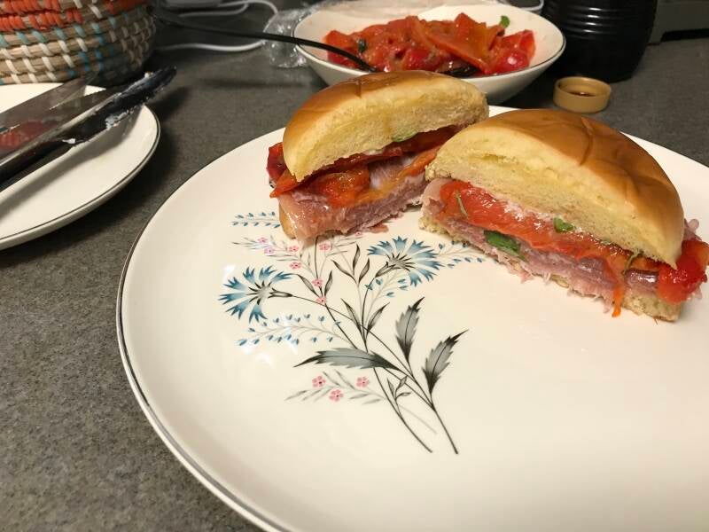 A gourmet Cannabis Prosciutto and Red Pepper Sandwich on a brioche bun, the ultimate lunch for cannabis edibles and Stoner Strategies enthusiasts
