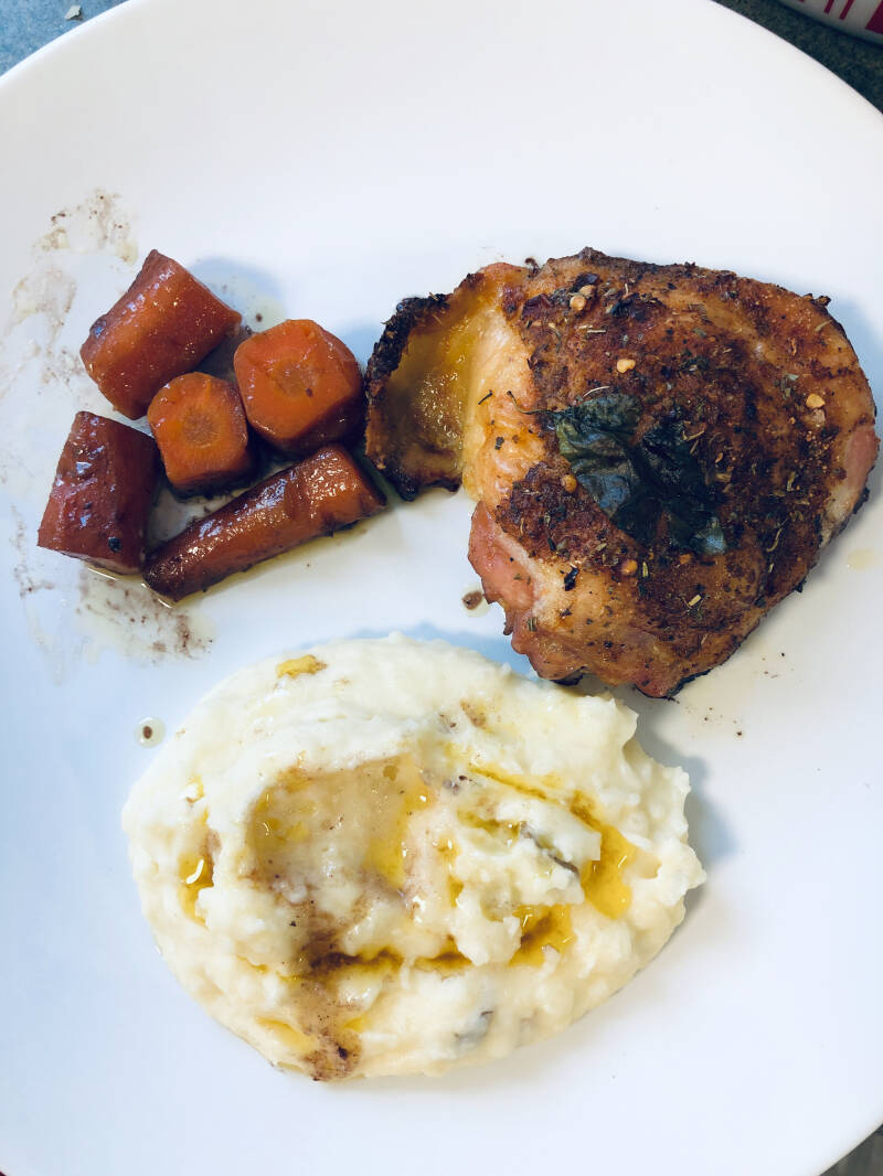 A plate of Cannabis Red Wine Herb Roasted Chicken Thighs & Carrots, perfect for cannabis edibles and stoner strategies enthusiasts