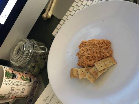 A bowl of warm, creamy Cannabis Buffalo Wing Dip, the perfect appetizer for cannabis edibles and Stoner Strategies readers