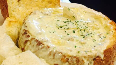 A golden, crusty bread bowl filled with creamy Cannabis Chicken Tetrazzini, a perfect savory dish for cannabis edibles and Stoner Strategies cooking