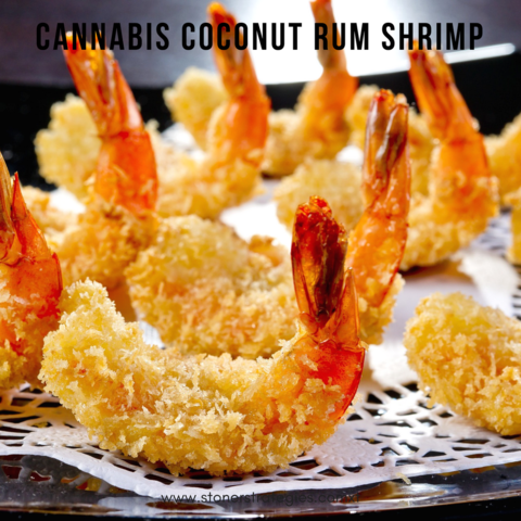 A plate of golden, crispy Cannabis Coconut Rum Shrimp, a perfect gourmet dish for cannabis edibles and Stoner Strategies readers