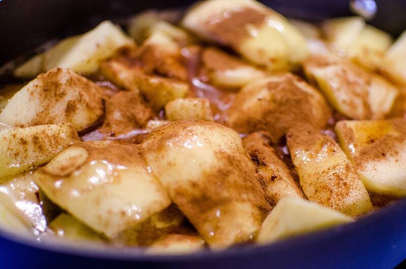 A warm skillet of Cannabis Cinnamon Apples, a seasonal treat for cannabis edibles and Stoner Strategies enthusiasts