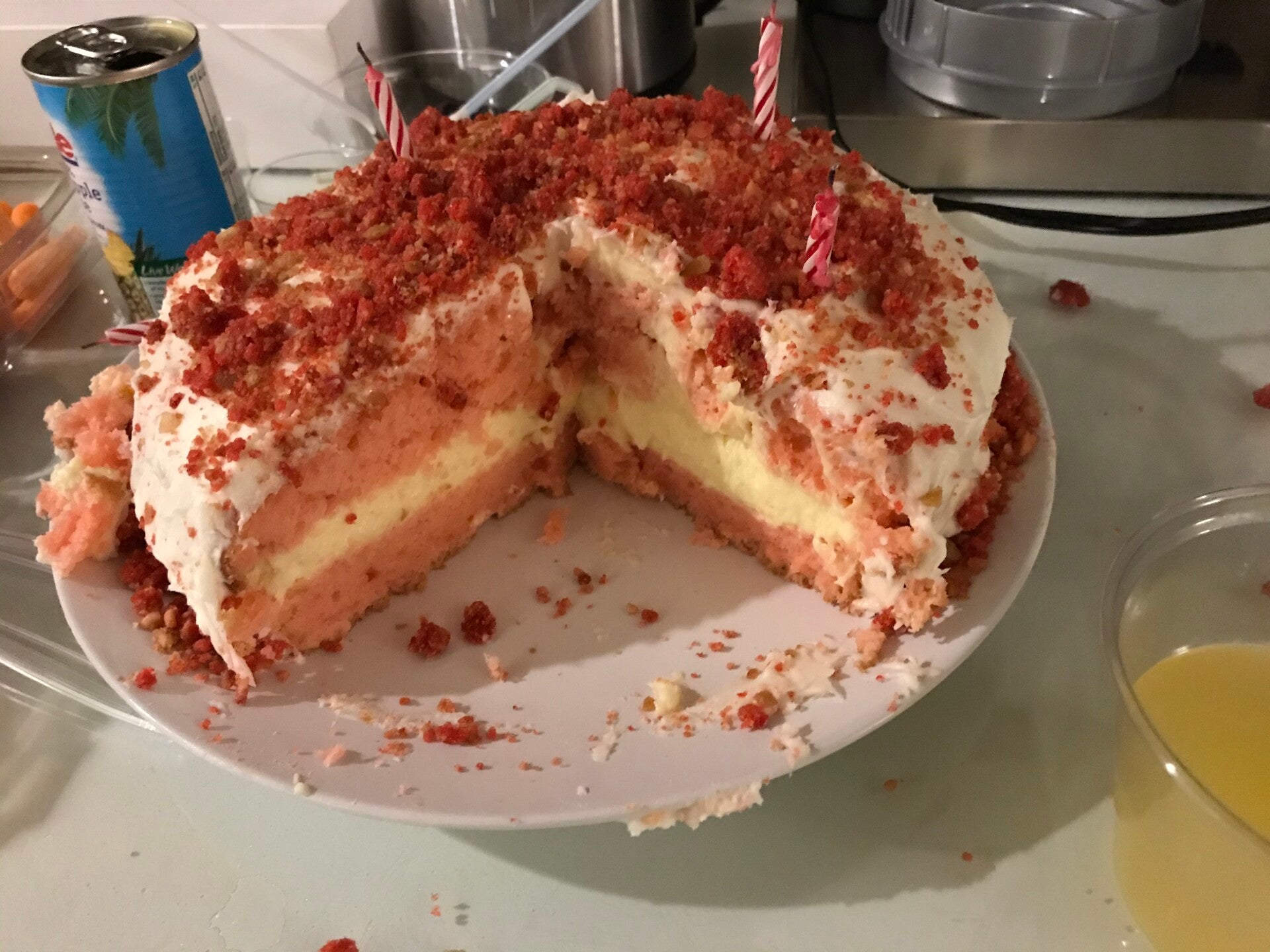 A layered Strawberry Cheesecake Stuffed Cake with crumble, a masterpiece for cannabis edibles and Stoner Strategies. enthusiasts