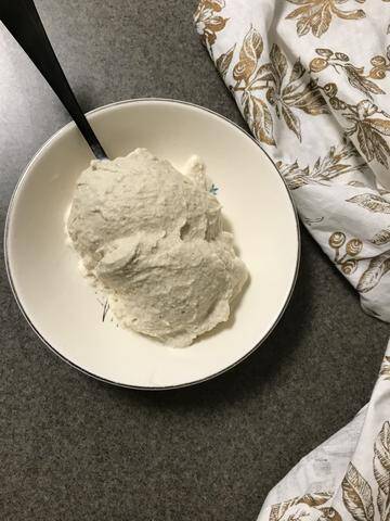 A scoop of Cannabis Cinnamon Maple Vanilla Ice Cream in a bowl, a premium choice for cannabis edibles and Stoner Strategies readers