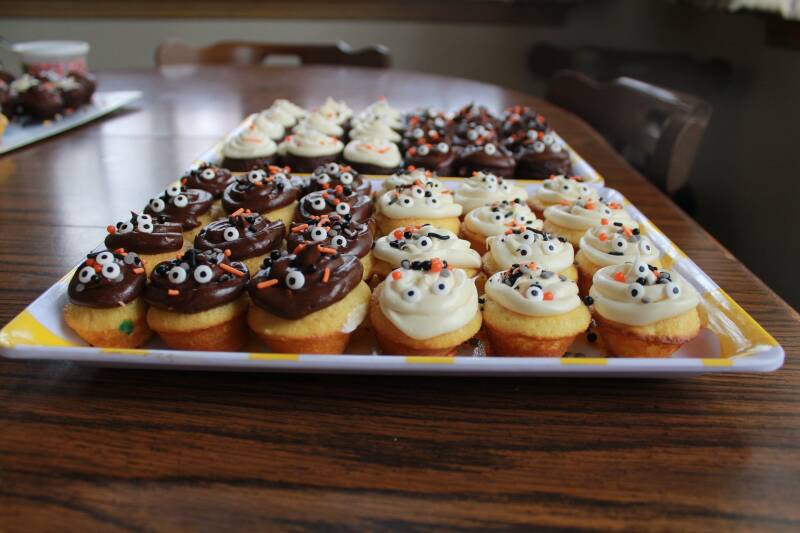 Frosted Halloween Cannabis Vanilla Cupcakes with spooky sprinkles, ideal for cannabis edibles and stoner strategies enthusiasts