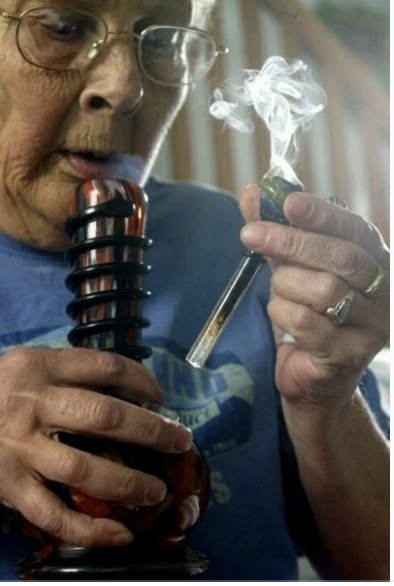 A playful photo of a grandmother using a glass bong to illustrate the importance of choosing the right downstem size.