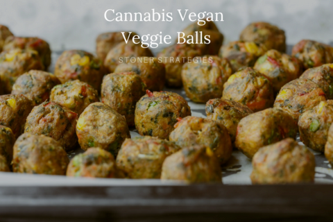 Golden brown, baked vegan cannabis veggie balls made with kale, peppers, and chickpeas on a baking sheet edibles recipe