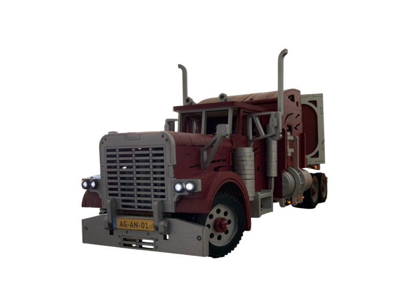 Volledig gebouwd Havy Boy truckmodel met trailer in rood en grijs