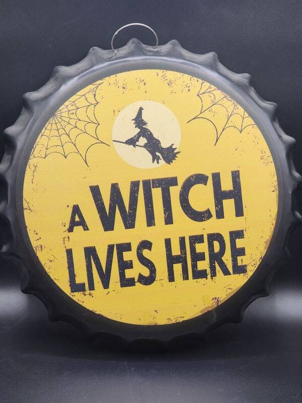 Tin Bottle Cap Sign - A Witch Lives Here - BC1