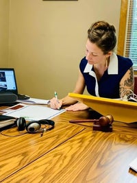 April writing legislation in one of her roles.