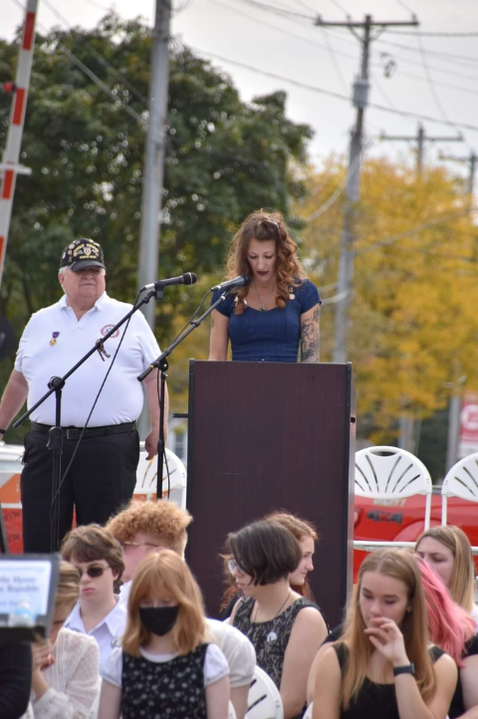 April Brandon speaking as Gold Star Mother and counselor while serving as Grand Marshal of the Holly homecoming parade.