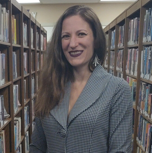 April smiling in the science fiction section.