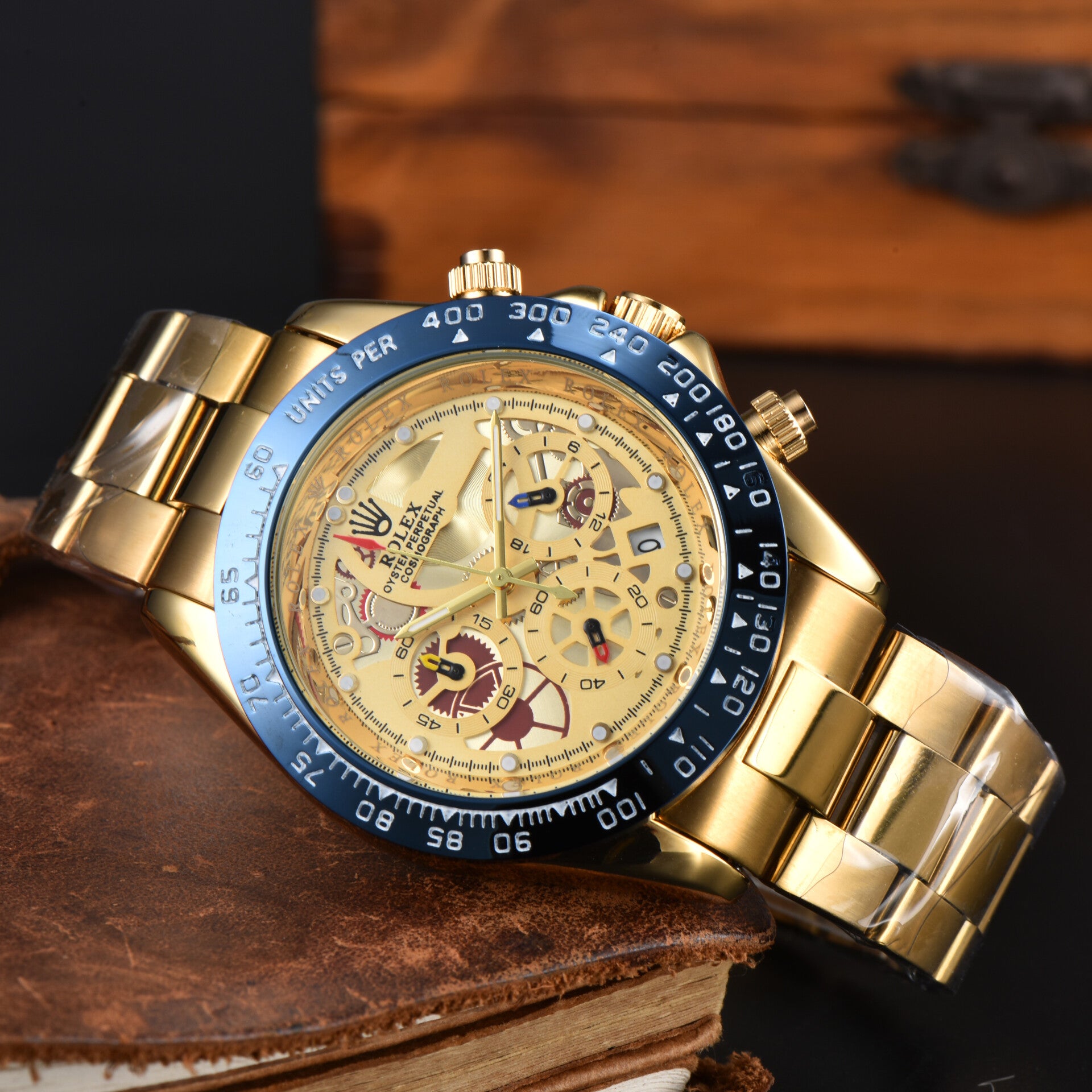 Golden Rolex Daytona La Montayo model N1 mechanical automatic with a skeleton dial and a blue bezel.