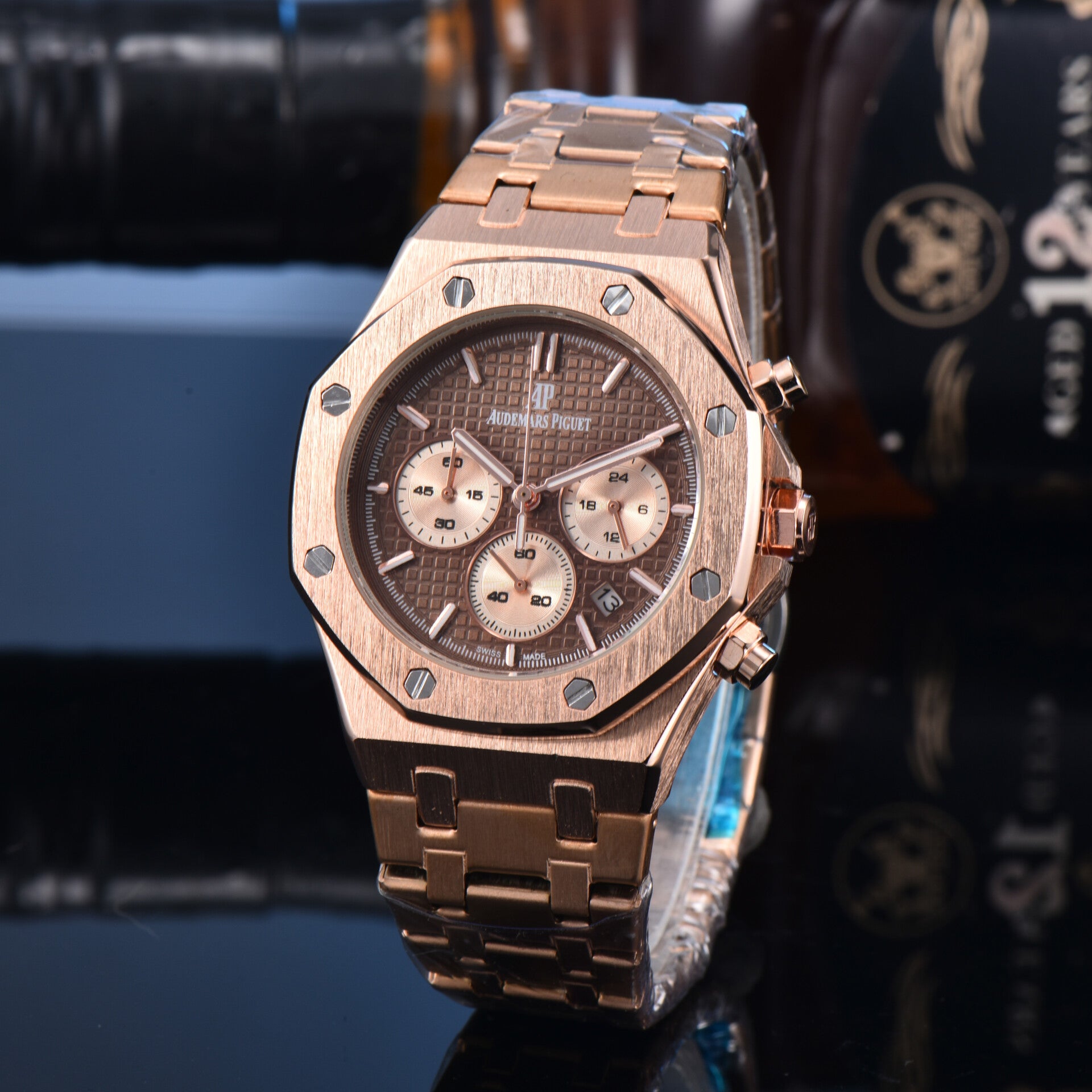 Audemars Piguet Royal Oak Chronograph 41mm in rose gold with a brown dial and matching bracelet.