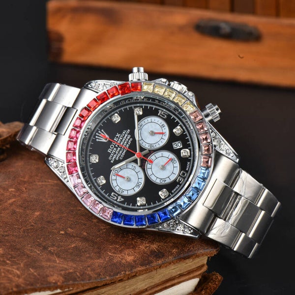 Rolex Cosmograph Daytona "Rainbow"  stainless steel case and bracelet, a black dial, and a bezel set with colored sapphires and diamonds.