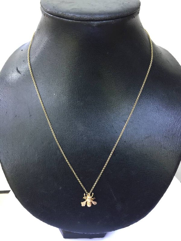 14k collier met 14k 'vlieg' hanger