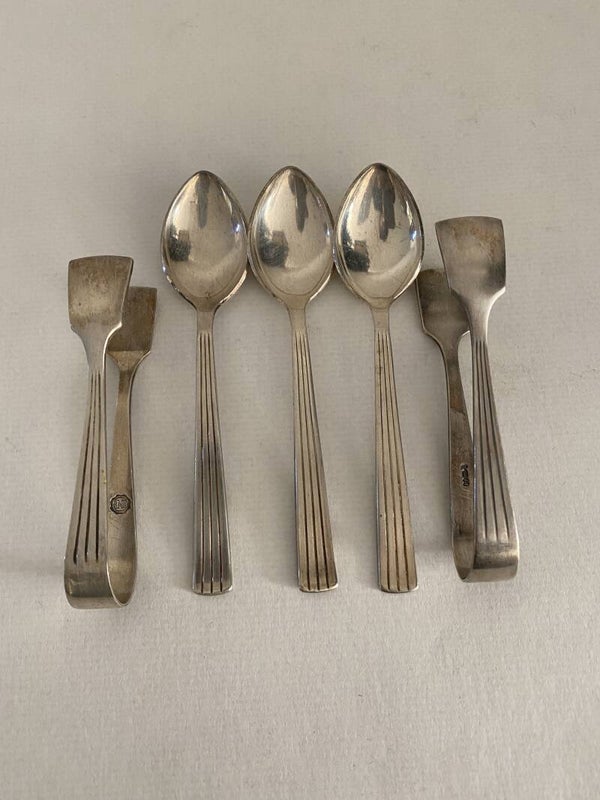 Verzilverde Douwe Egberts theelepeltjes en suikertangetjes