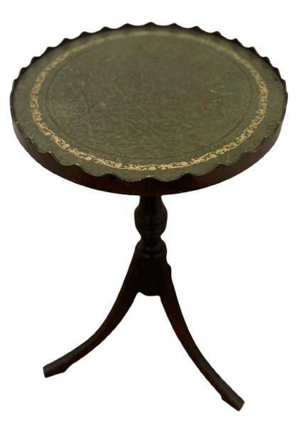 A lovely tooled leather top mahogany wine table