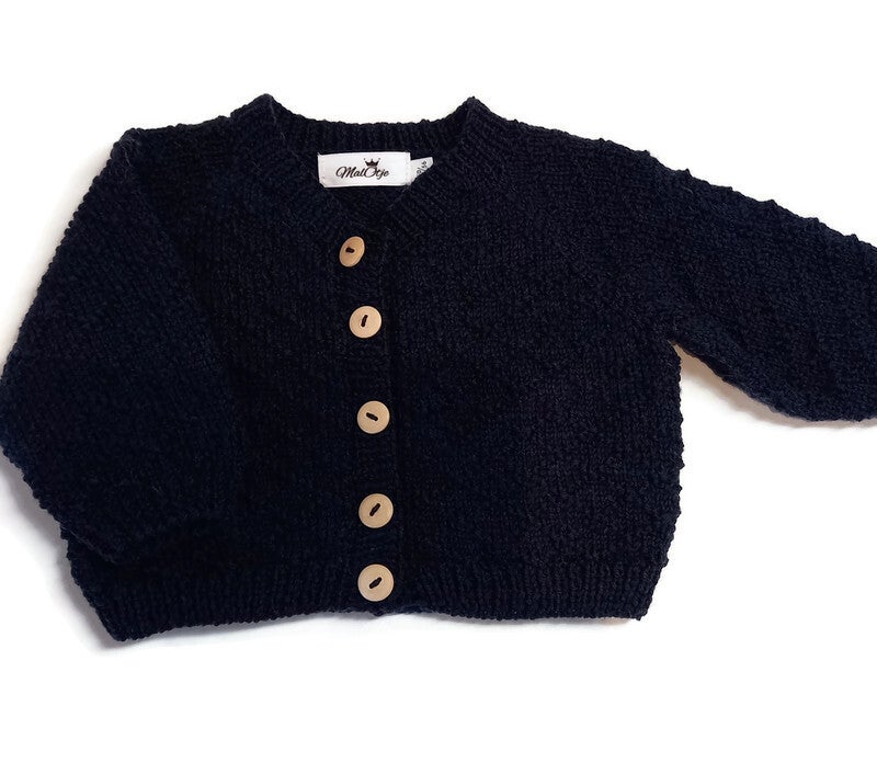 Merinos wollen vestje met ruit patroon. Maat 50/56.