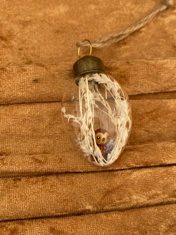 Glazen ei met luiaard