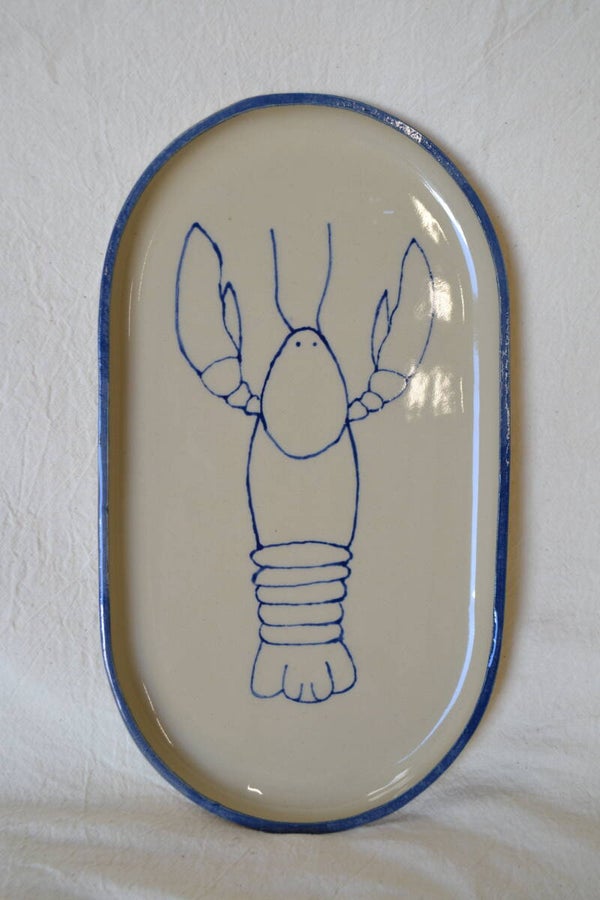 Grote ovaal bord met kreeft