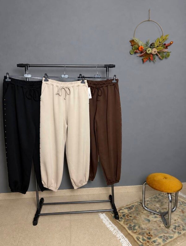 PANTALÓN CHÁNDAL TACHUELAS