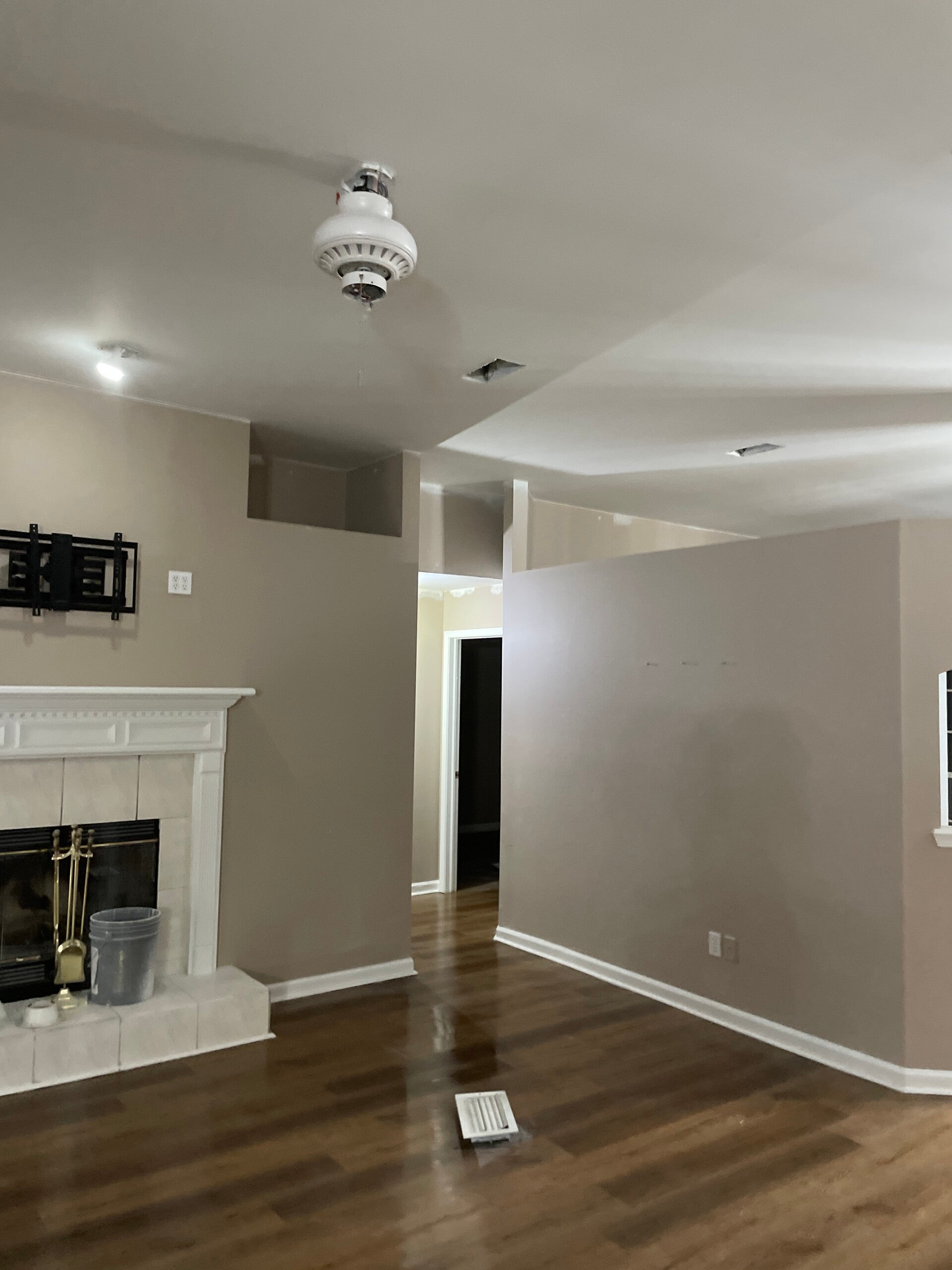 Picture of living room with chimney and wooden floors