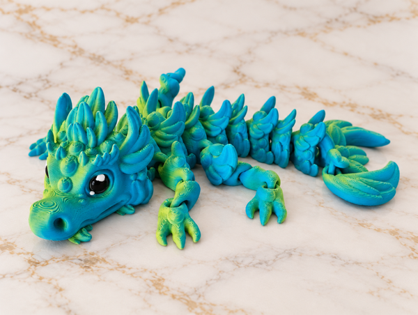 Beweegbare fidgetdraak – groen & blauw – 19 cm