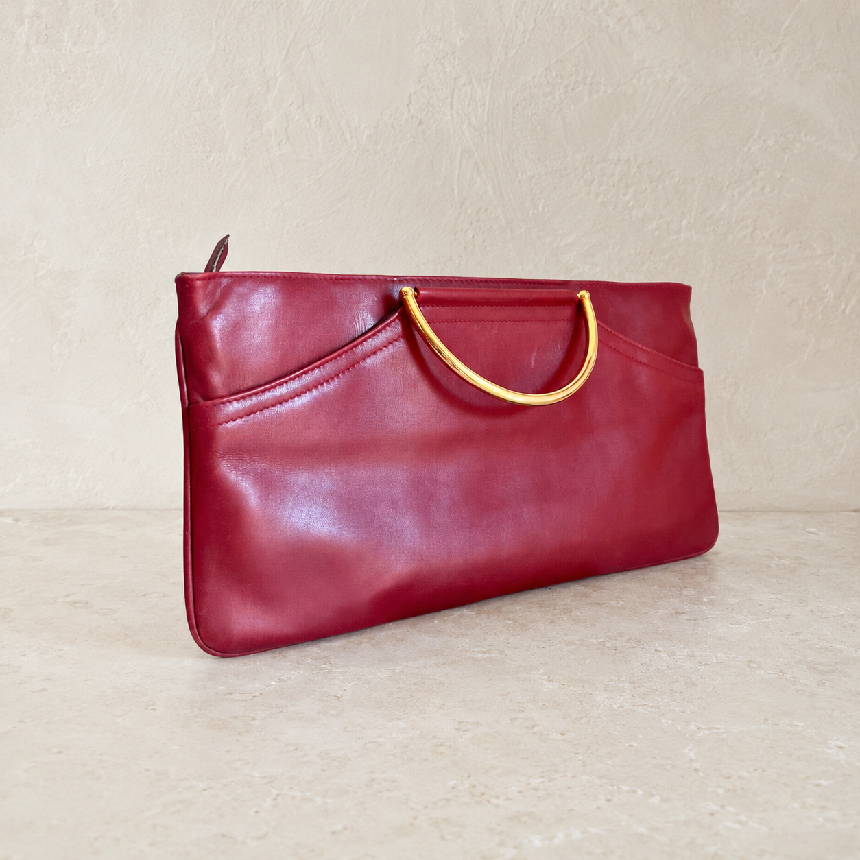 Sac à main bordeaux à poignées dorées transformable en pochette – Élégance et raffinement intemporel