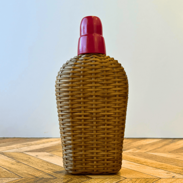 Ancienne gourde en verre recouverte d'osier