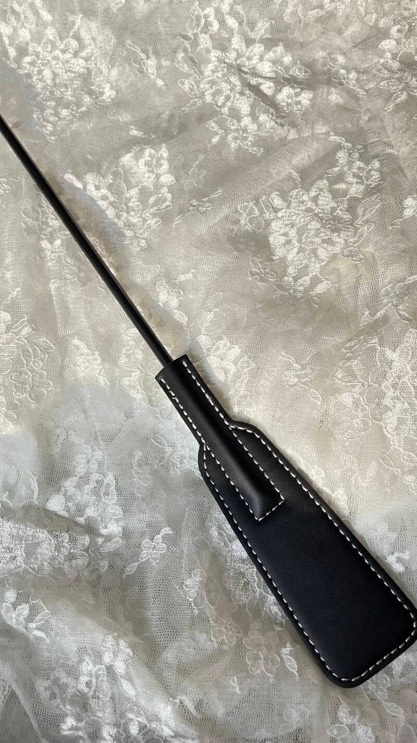 Tapette à plume en cuire