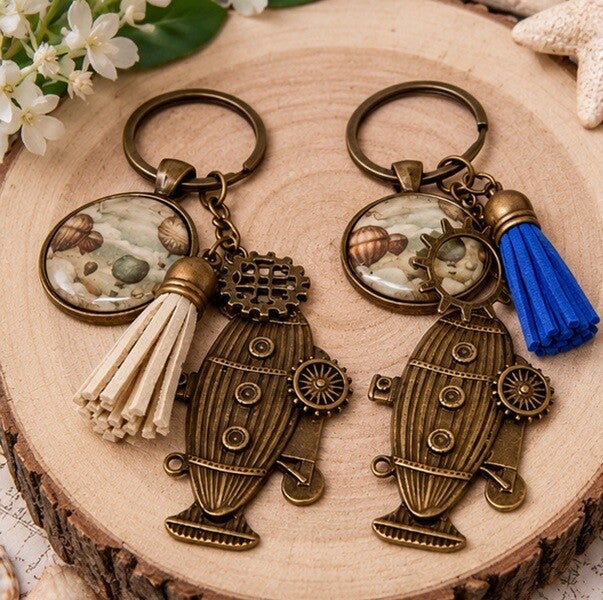 Porte-clés homme illustré vintage – Explorateurs du Temps – Cabochon en verre