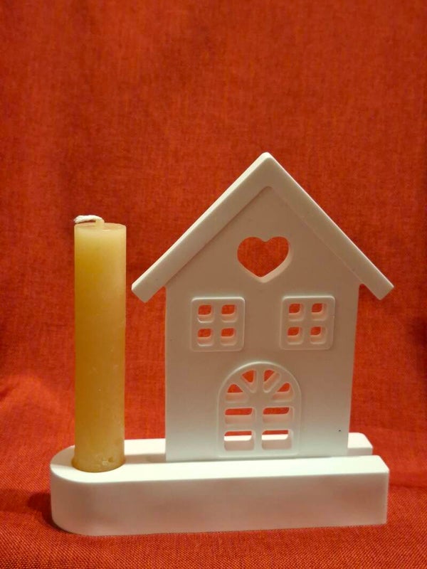 Haus im Ständer mit Stabkerze
