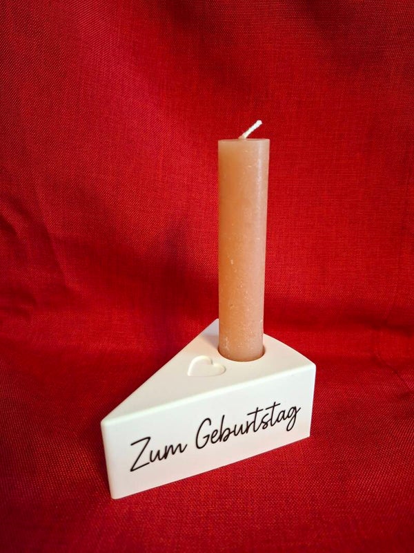 Tortenstück mit Stabkerze