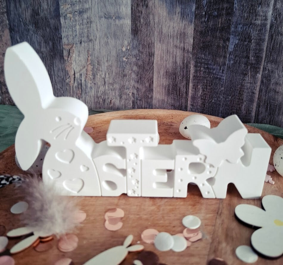 Schriftzug Ostern mit Hase