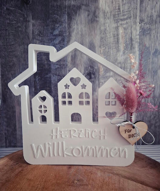 "Herzlich Willkommen" in Hausform