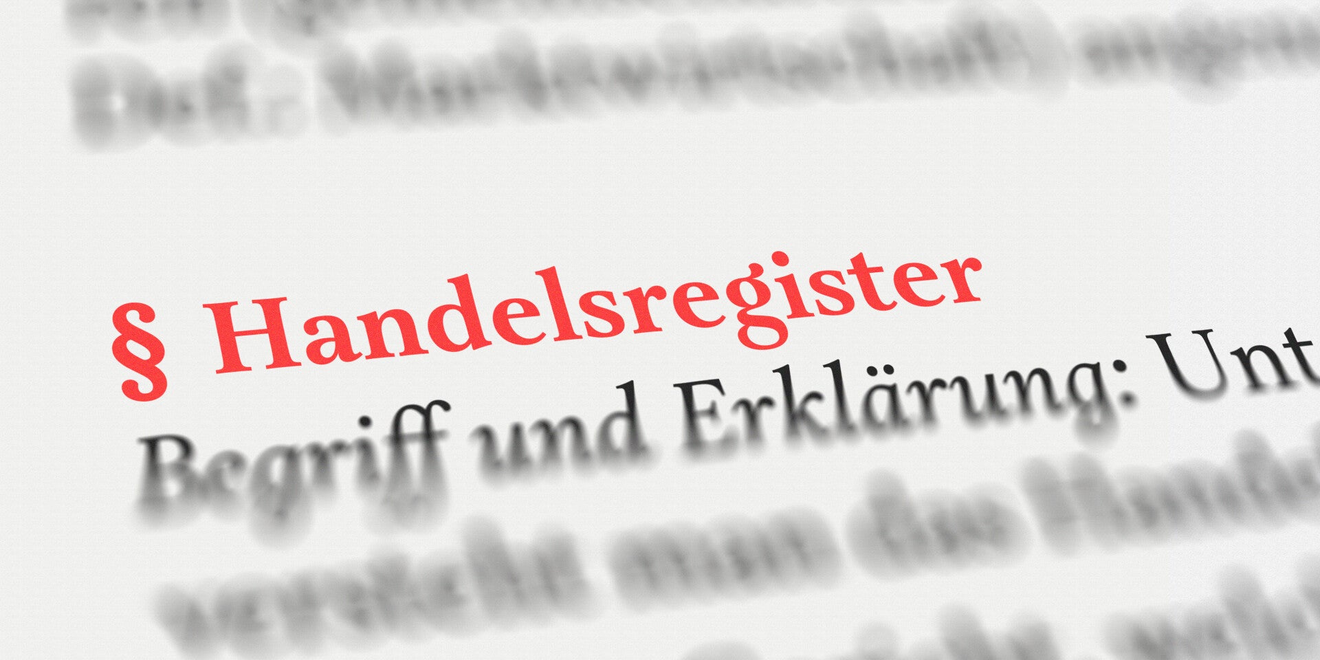Symbolbild für Handelsregisterauszug, rote Schrift und Paragrafenzeichen