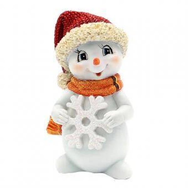 Schneekind Liam mit Schneeflocke