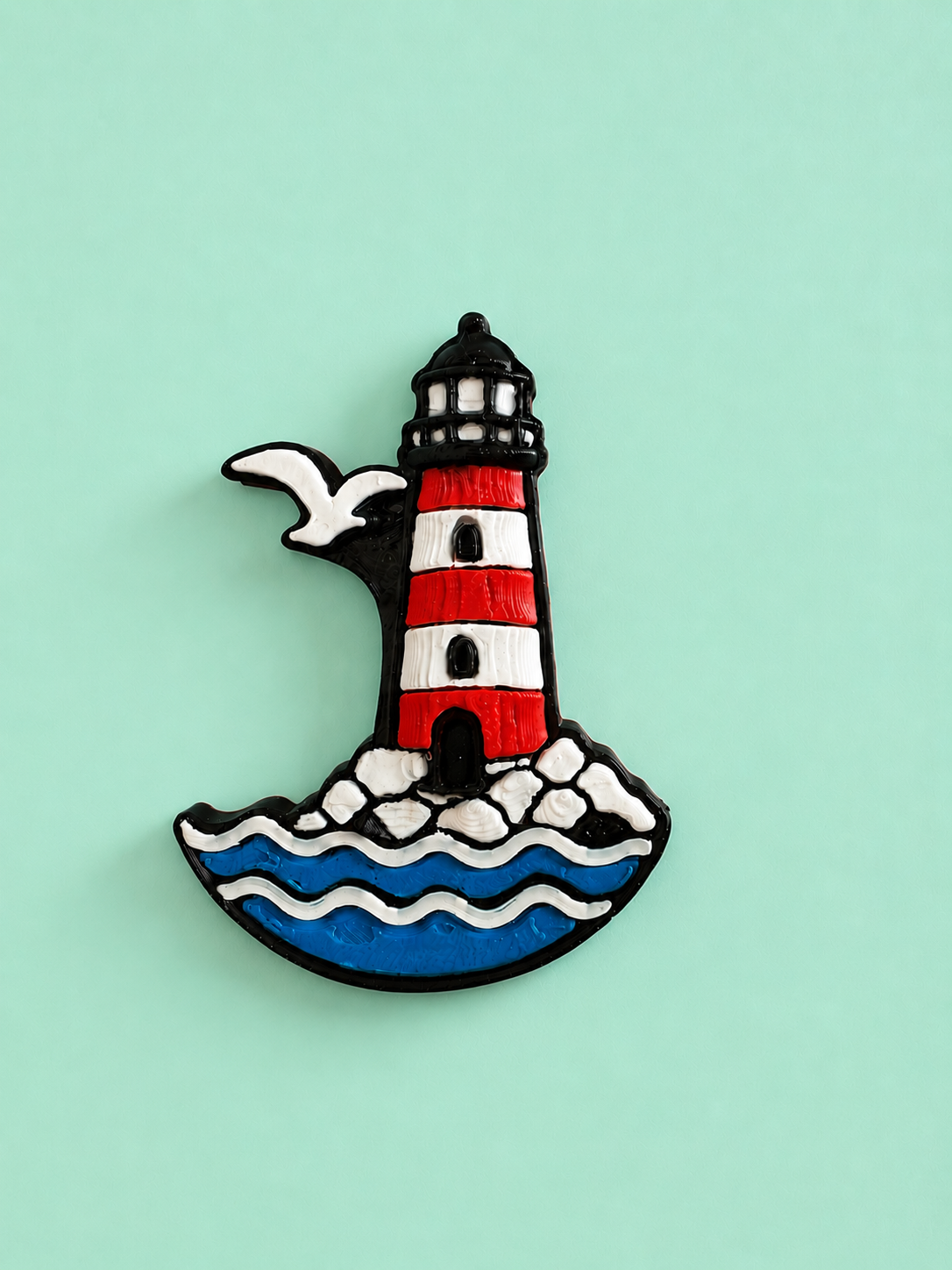 Kühlschrankmagnet mit Leuchtturm und Möwe