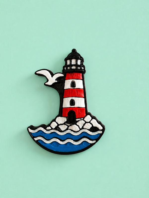 Kühlschrankmagnet mit Leuchtturm und Möwe