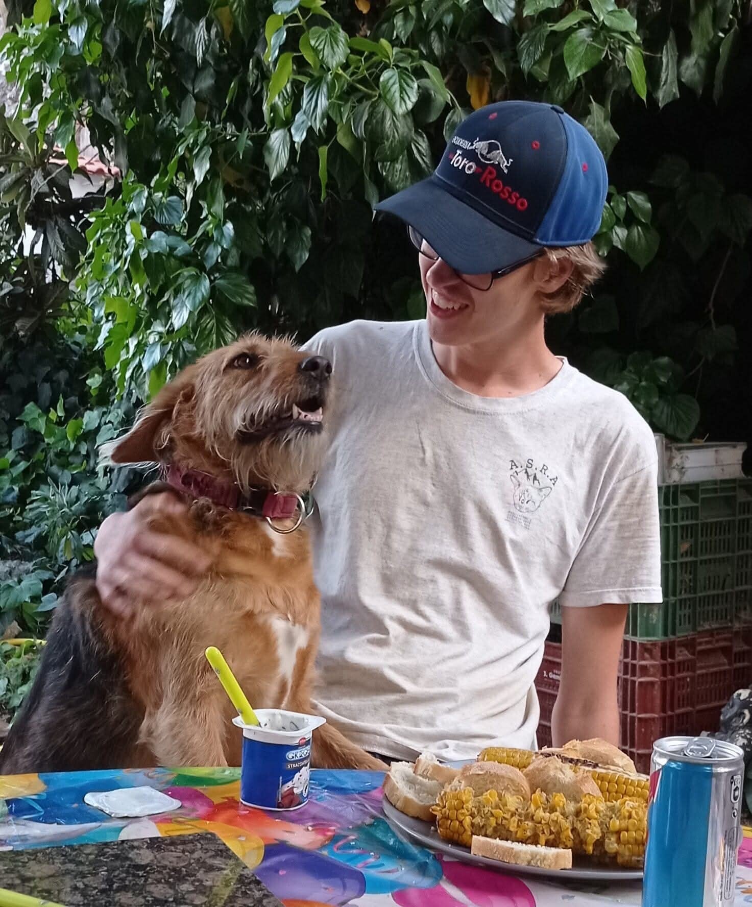 One of the ASRA family younger members cuddling an old dog.  They both look really happy