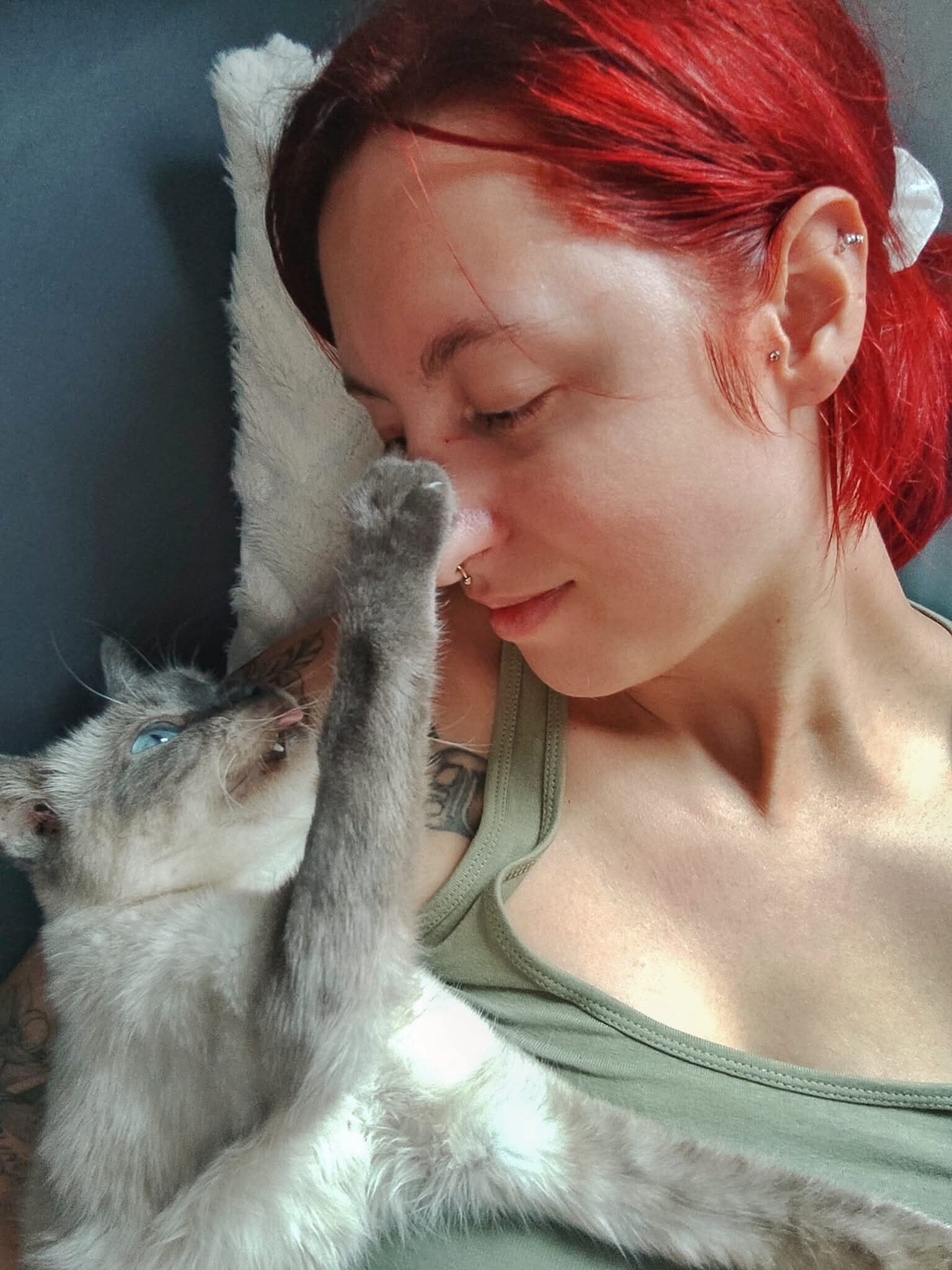 a young member of the ASRA family cuddling a very old blue eyed grey cat.  They both look so relaxed and happy
